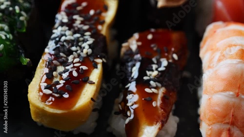 sushi on a black plate