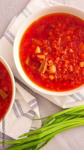 tomato soup in a bowl on wooden table