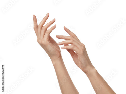 Graceful woman hands extended upward with delicate fingers.