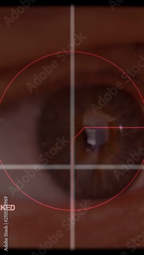 Vertical video: Reticle starting centered scanning brown iris, pointer sliding aligning glint