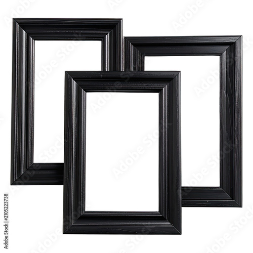 Three empty black wooden picture frames are artistically arranged against a black background.