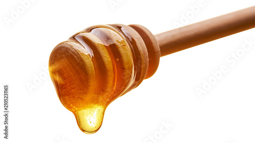 Fotografie Golden honey dripping from wooden dipper stick