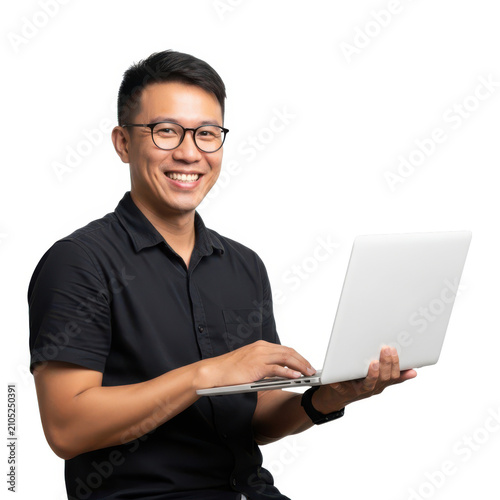 A young man holding a laptop with a friendly smile on his face.