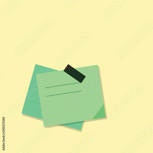 Two green sticky notes with black tape isolated on a clean light yellow background