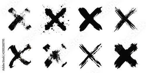 Set of eight hand drawn black ink cross marks and grunge brush strokes