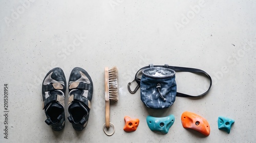 Rock climbing gear flat lay on concrete background