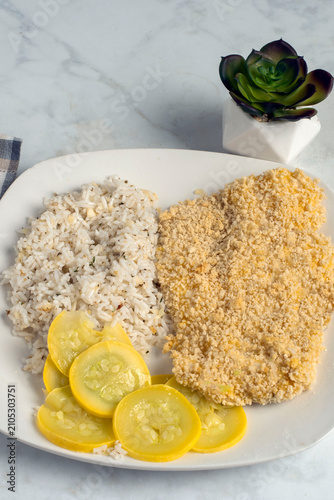 Bild auf Leinwand baked haddock  with  summer squash and rice