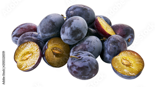 Photography Pile of fresh ripe plums some whole, some halved showing juicy yellow flesh and