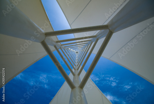 Geometric Triangular Metal Structure Against Blue Sky