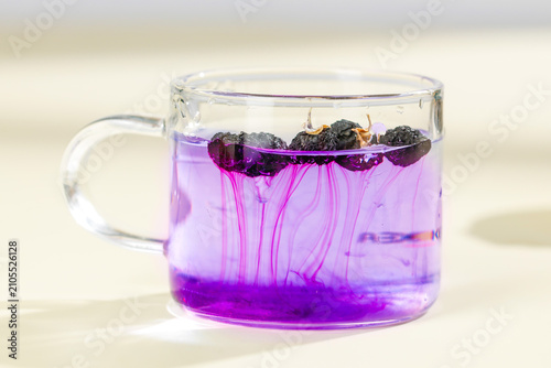 Obraz na płótnie Traditional Chinese Wolfberry Tea with Black Goji Berries in Glass Mug Creating