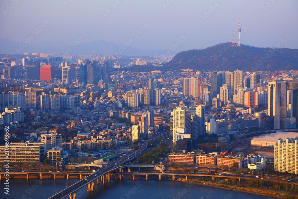 Obraz premium Seoul cityscape in South Korea. Sunset aerial view with Yongsangu district and Namsan hill.