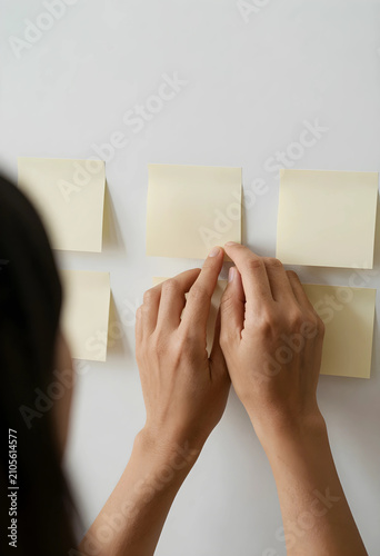 Persons hands placing blank...