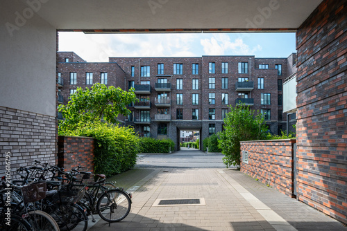 View from under an archway on a modern apartment building in summer