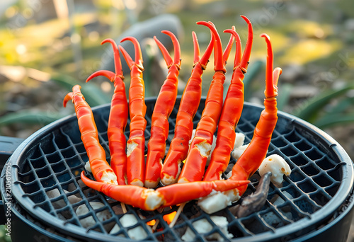 Red crab legs grilling on a...