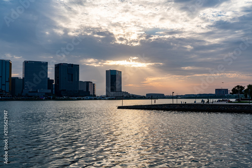 Fotografie Waterfront City Skyline at Sunset