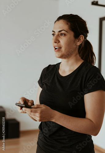 Young adult woman holding a...