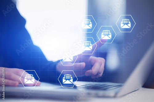 Digital interaction with email icons and computer during work session at office