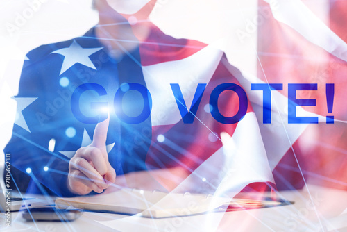 Canvas Print Support for voting with a person pointing and a United States flag in a setting