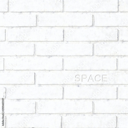 A White Brick Wall Background With The Word Space Faintly Embossed Onto The Bricks