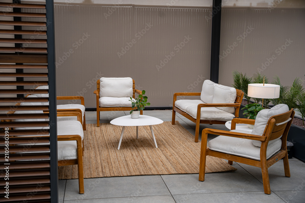 Fototapeta premium Modern terrace lounge with white armchairs