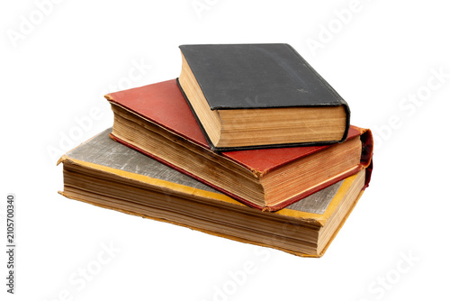Obraz na płótnie A small stack of three old vintage hardcover books isolated on white back