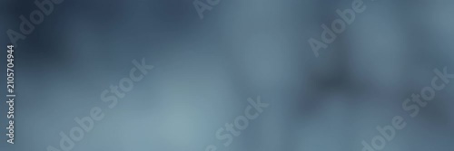 Soft blue gray blurred gradient with dark atmospheric shadows, website banner seamless loop animation for a minimal abstract background