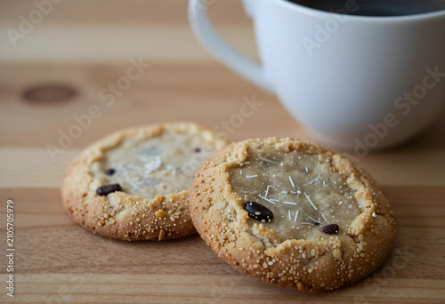 Two cookies with coffee cup...