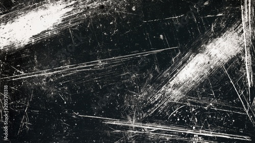Grungy, distressed, scratched surface with bright white streaks on black