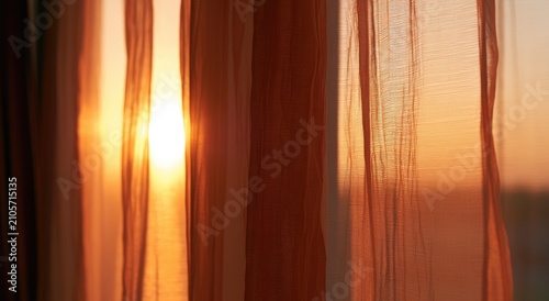 Warm sunbeams filter through sheer, vertical curtains, casting a soft glow