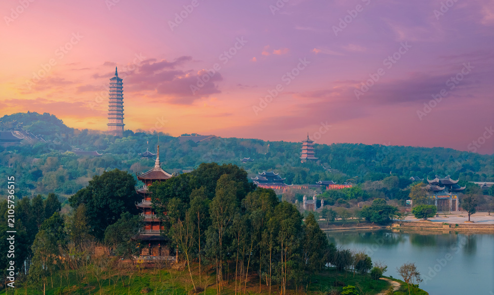 Fototapeta premium Aerial Scenic view of Bai Dinh pagodas and mountains at sunset in Ninh Binh, Vietnam
