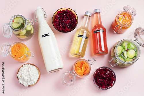 Flatlay of fermented foods and drinks for Gut Health Diet. Kombucha, kefir, pickled vegetables