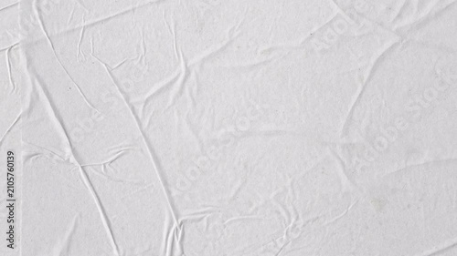 Abstract crumpled paper texture background with soft lighting. Minimal clean surface for design, presentations, typography, overlay and motion graphics. Seamless looping 4k