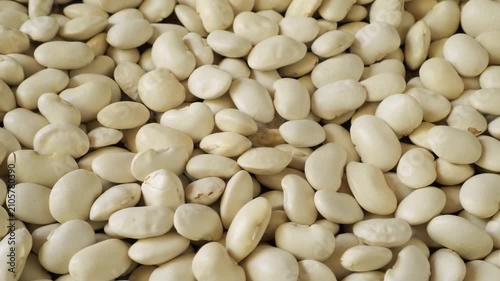 White lima beans slowly moving as food background
