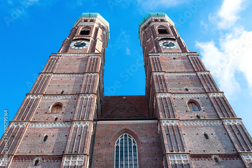 A view of the Frauenkirche's tall towers in Munich, looking towards the sky.