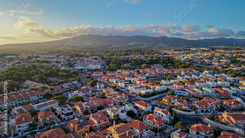 Bild auf Leinwand Aerial of dense hillside town with red roofed buildings