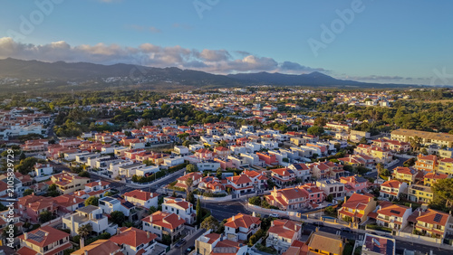 Fotografie Aerial of dense hillside town with red roofed buildings