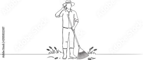 Photos male farmer holding rake with call me gesture and wearing straw hat to working on farm at harvest time
