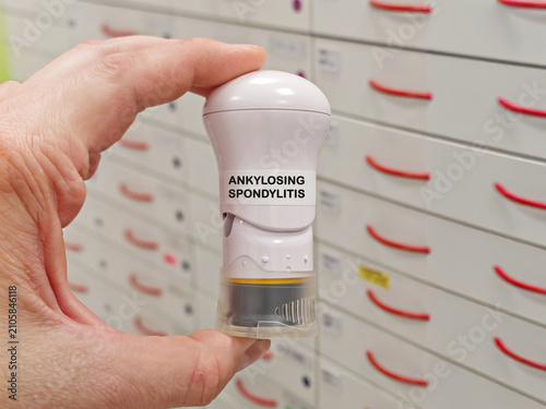 фотографія ANKYLOSING SPONDYLITIS medical concept with an autoinjector