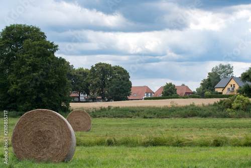 cottag and straw bales in the field