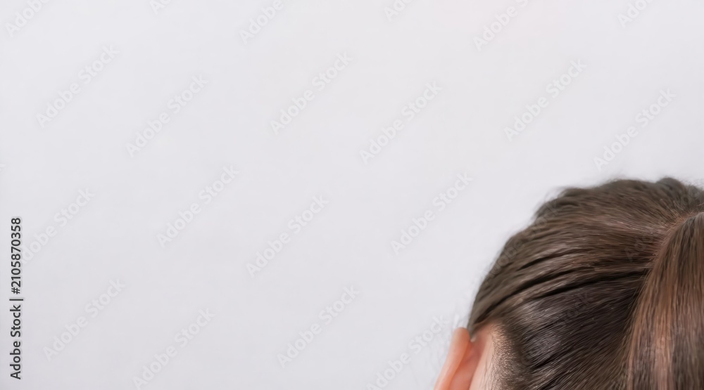Fototapeta premium Person's dark hair top of head close up