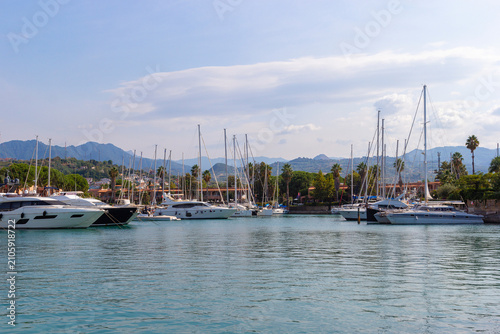 Bild auf Leinwand Luxury yachts and sailing boats moored at Portorosa Marina in Tonnarella, Sicily, Italy