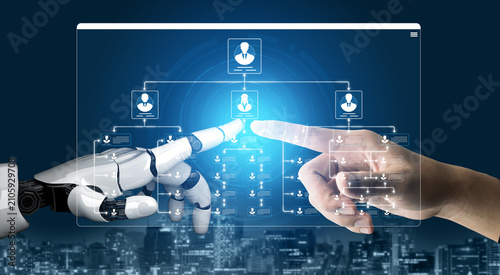 Foto Collaboration Between Human Hand and Robotic Hand in Digital Interface Showcasin