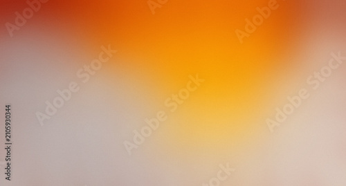 Warm abstract gradient background with orange and yellow tones, blurred transition with a grainy texture, creating a vibrant and energetic feel.

