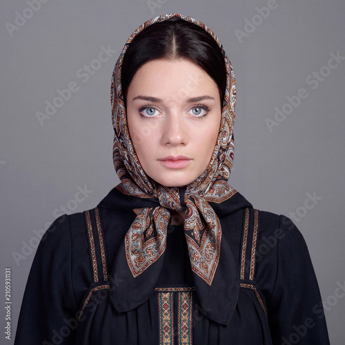 Studio portrait of a young beautiful brunette model