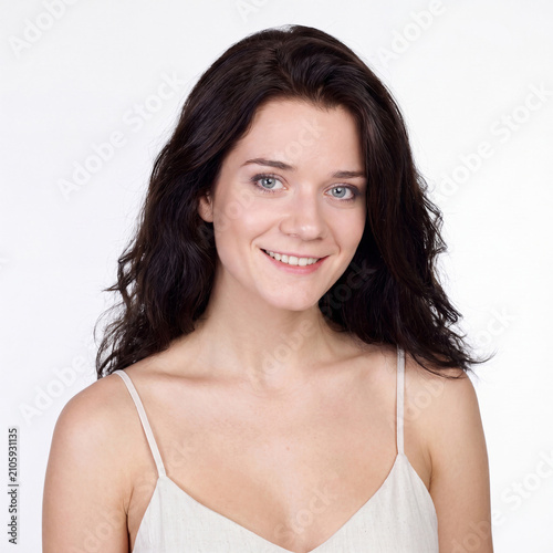 Beauty portrait of young beautiful brunette woman with bare shoulders