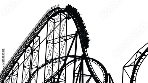 Black silhouette of a massive steel roller coaster featuring people riding during a steep descent