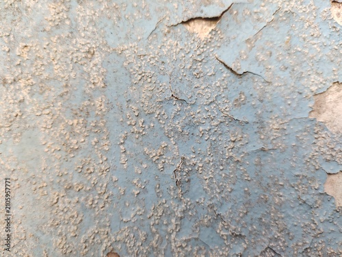 A distressed wooden surface featuring random peeling paint, chipped layers, cracks, scratches, and naturally weathered wood grain. The irregular worn texture creates a rustic, vintage, and aged appear
