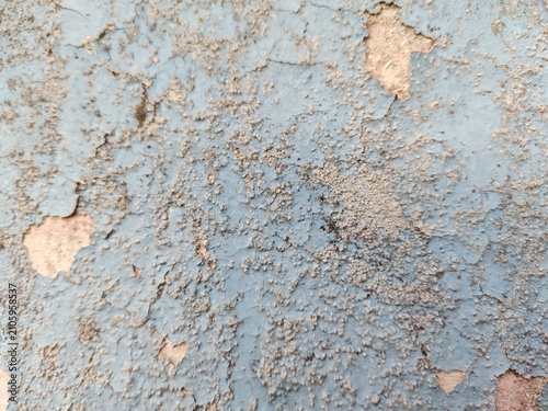 A distressed wooden surface featuring random peeling paint, chipped layers, cracks, scratches, and naturally weathered wood grain. The irregular worn texture creates a rustic, vintage, and aged appear