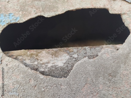 A distressed wooden surface featuring random peeling paint, chipped layers, cracks, scratches, and naturally weathered wood grain. The irregular worn texture creates a rustic, vintage, and aged appear