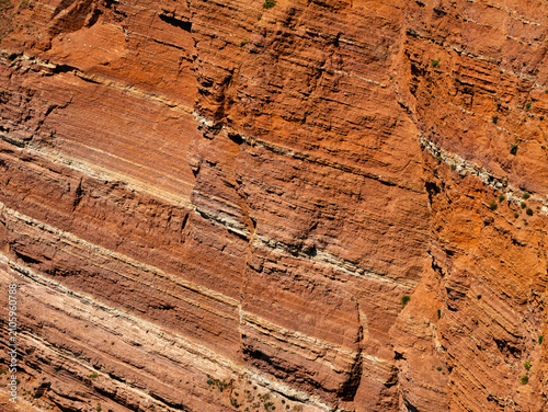 Obraz na płótnie Close-up of the red sandstone cliff layers of Helgoland Island, Germany, reveali